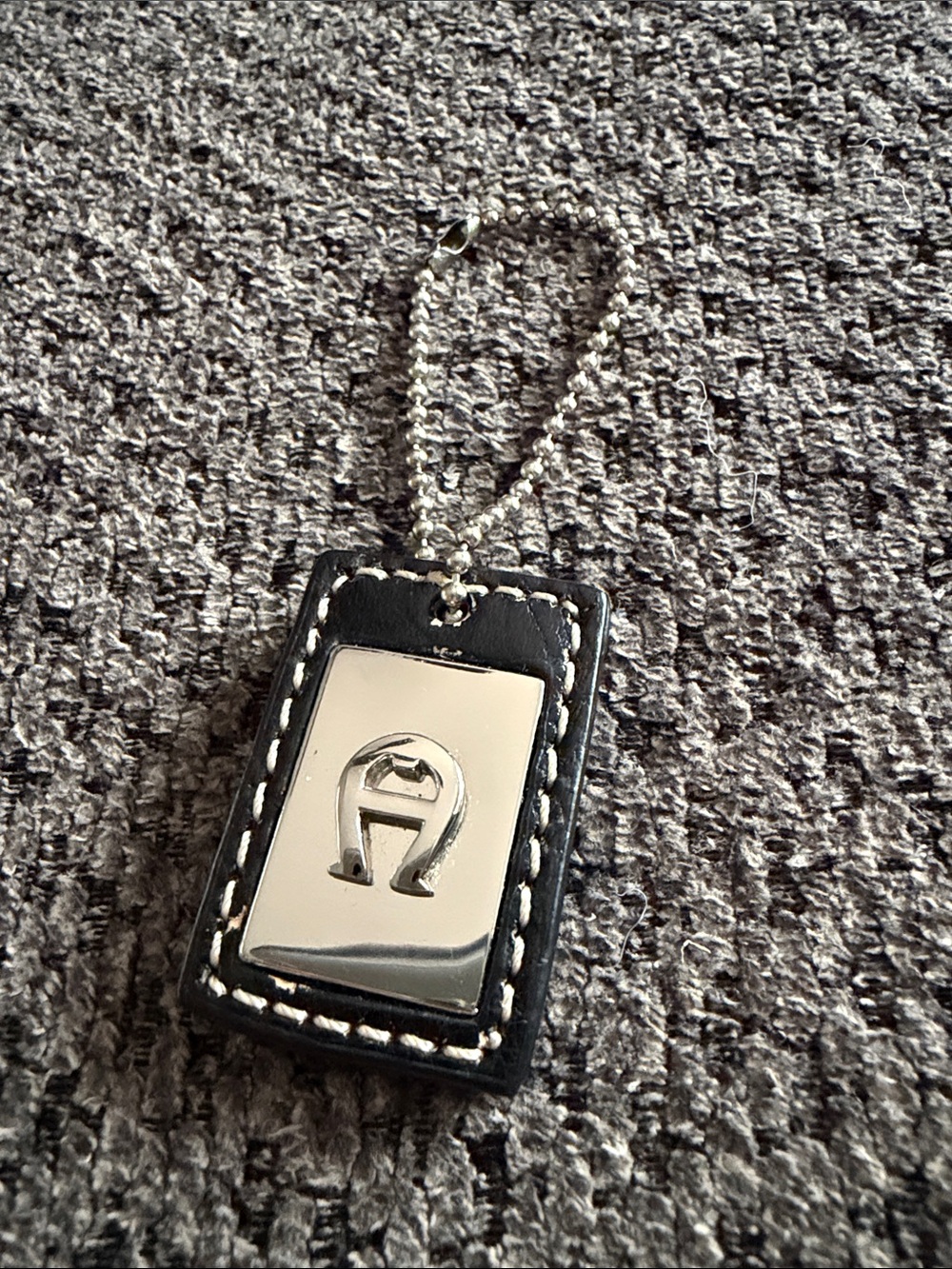 Etienne Aigner Black and Silver Leather Keychain Phone Charm with Metal Accent